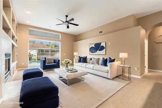 a living room with furniture and a large window