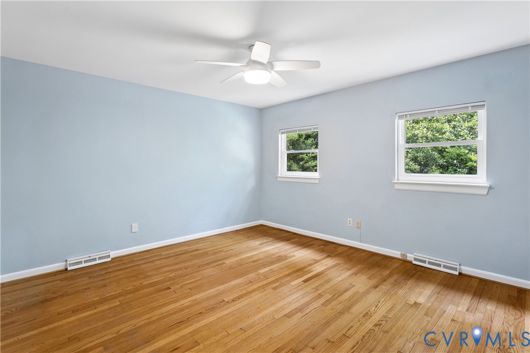 3136 Old Quarry Road Richmond, VA 23225 - Photo 50 of 94 Spacious room featuring wood flooring, neutral blu