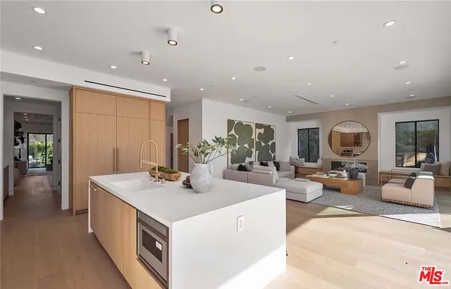 a view of a living room and kitchen