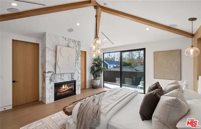 a bed room with a bed and a fireplace