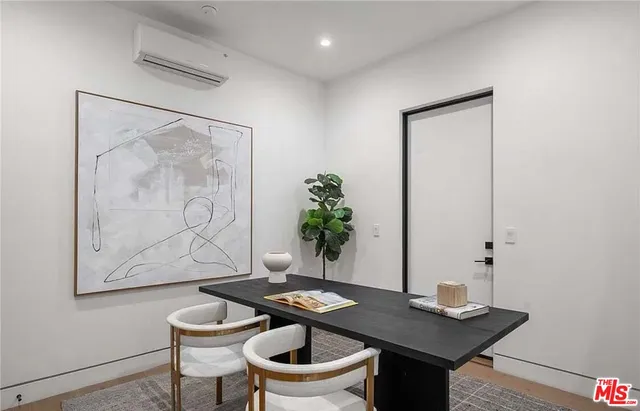 a view of a workspace with furniture