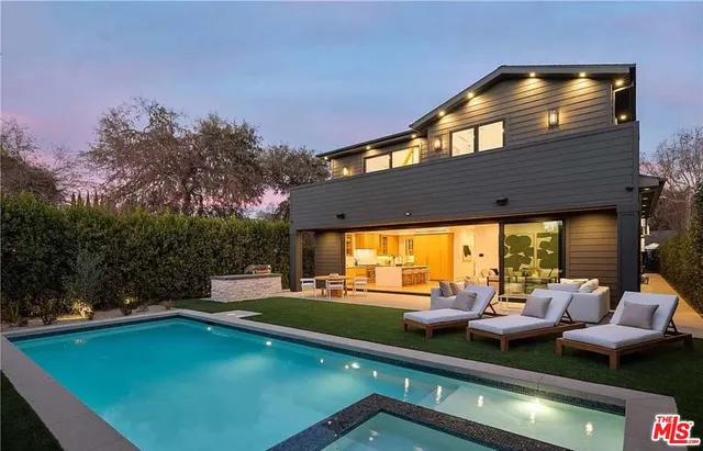 a view of a patio with table and chairs and potted plants