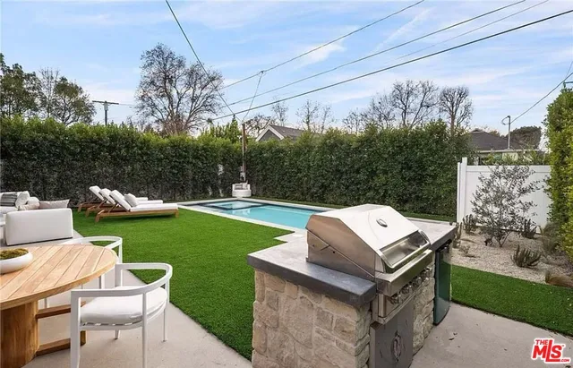a view of a chairs and table in the patio