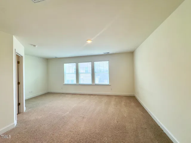 an empty room with window