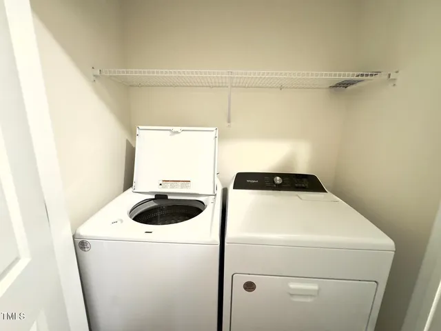 a view of a kitchen with a sink and microwave
