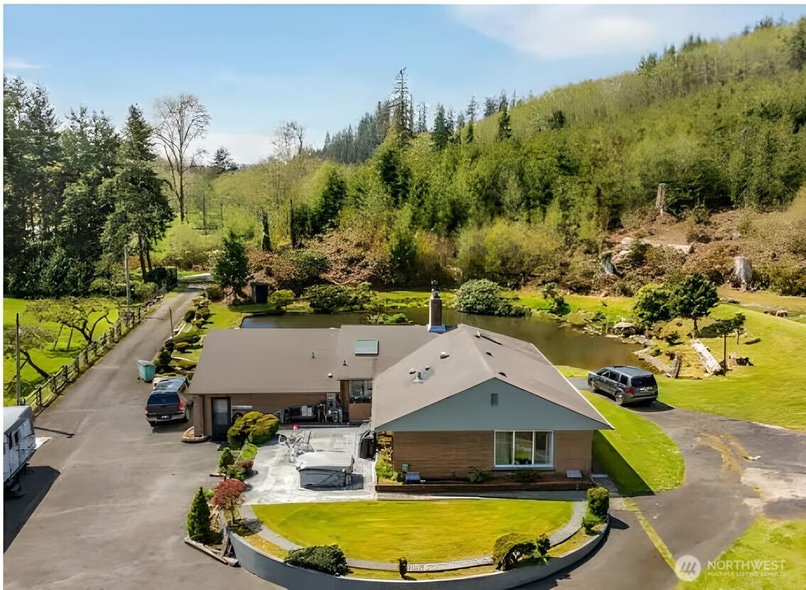 121 Bear Gulch Road Aberdeen, WA 98520 - Photo 1 of 18 an aerial view of a house with a yard basket ball court and outdoor seating