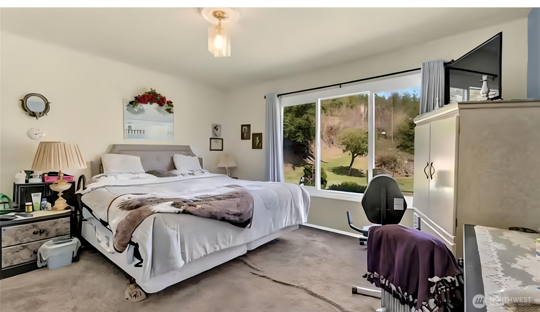 121 Bear Gulch Road Aberdeen, WA 98520 - Photo 5 of 18 a bedroom with a bed and a large window