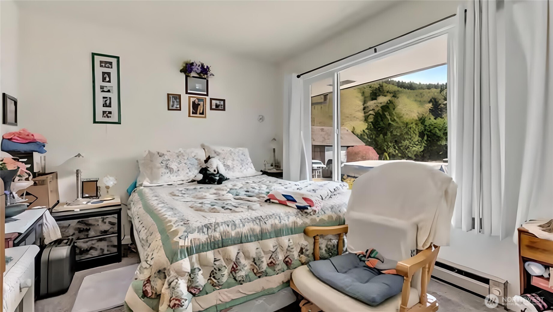 121 Bear Gulch Road Aberdeen, WA 98520 - Photo 6 of 18 a bedroom with a bed and wooden floor