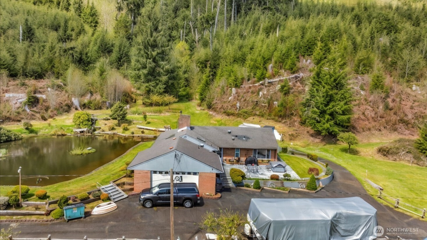 121 Bear Gulch Road Aberdeen, WA 98520 - Photo 10 of 18 an aerial view of a house with swimming pool and large trees