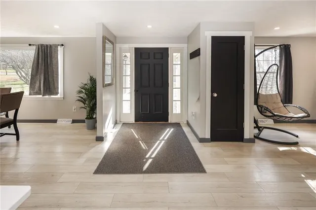 a view of a livingroom with furniture and windows