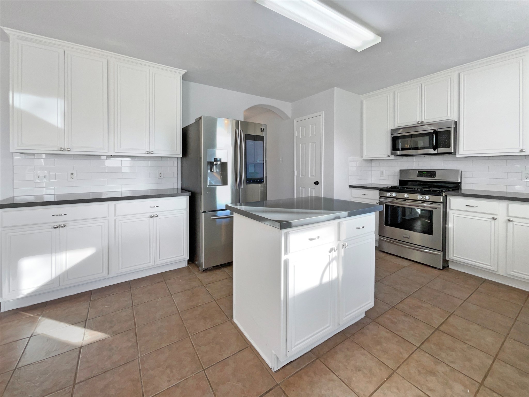 12111 Virline Lane Houston, TX 77067 - Photo 11 of 22 a kitchen with stainless steel appliances granite countertop a sink and cabinets