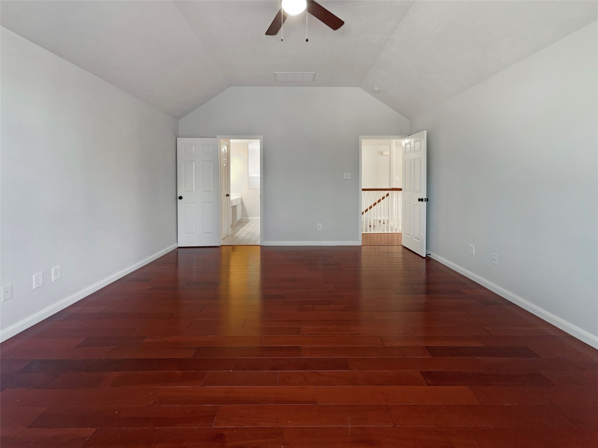 12111 Virline Lane Houston, TX 77067 - Photo 4 of 22 an empty room with wooden floor chandelier fan and windows