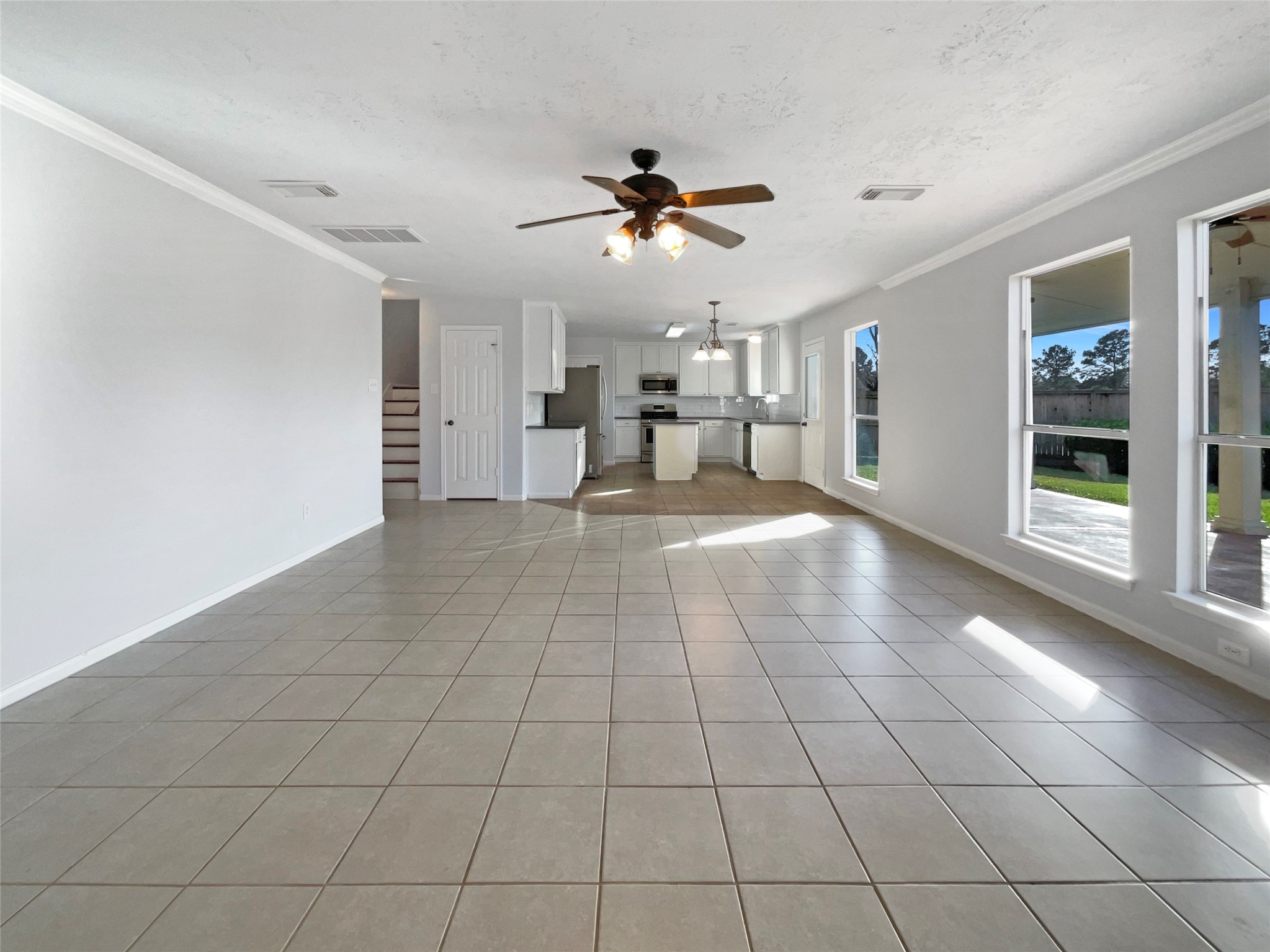 12111 Virline Lane Houston, TX 77067 - Photo 8 of 22 a view of a livingroom with a furniture and ceiling fan