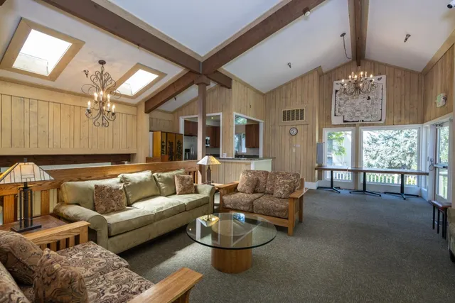 a kitchen with stainless steel appliances granite countertop a refrigerator a stove top oven a sink and dishwasher