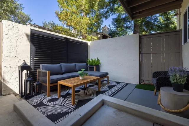 a view of outdoor sitting area with furniture