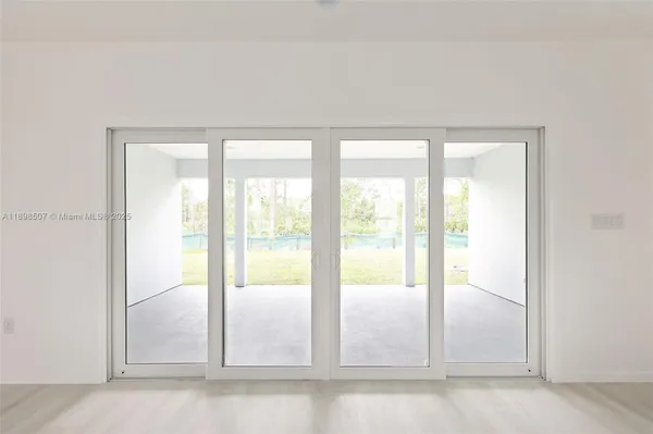 a view of an empty room and window