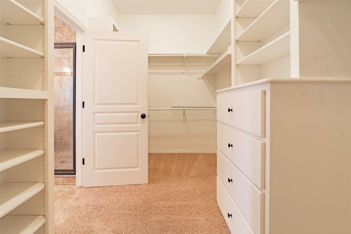 125 Walter Way Jarrell, TX 76537 - Photo 27 of 40 Walk in closet with light colored carpet