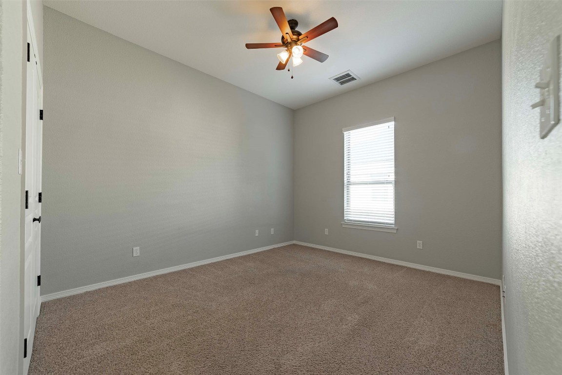 125 Walter Way Jarrell, TX 76537 - Photo 33 of 40 Unfurnished room with carpet flooring and ceiling fan