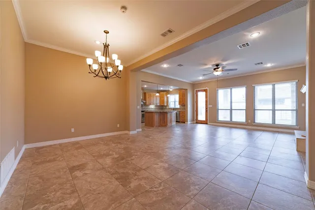 a view of a room with chandelier and windows