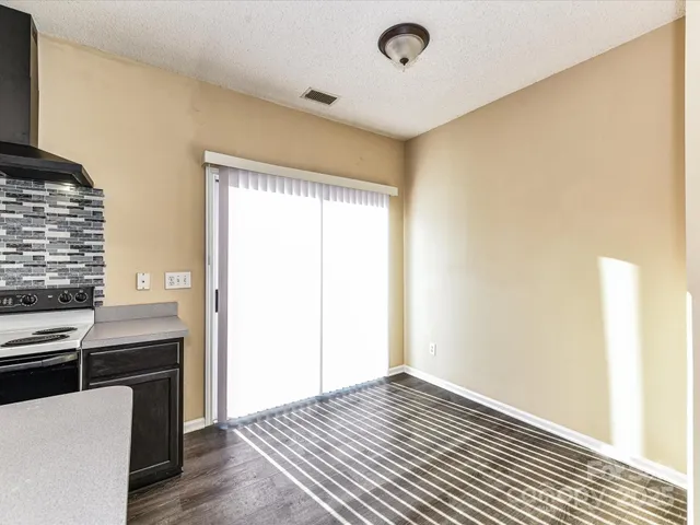 a view of kitchen with furniture and wooden floor