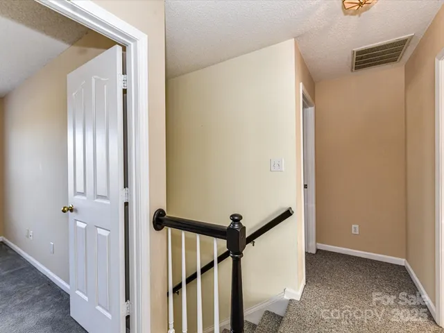 a view of a hallway with the door