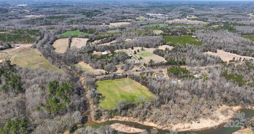 3400 Biggers Road Concord, NC 28025 - Photo 17 of 21 an aerial view of a house with a yard and lake view