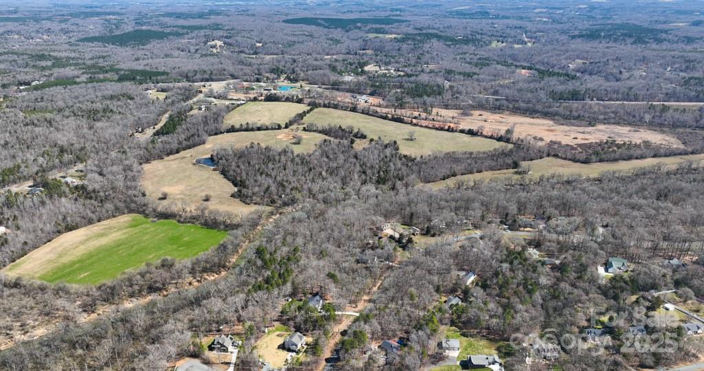 3400 Biggers Road Concord, NC 28025 - Photo 4 of 21 a view of a dry yard with large trees