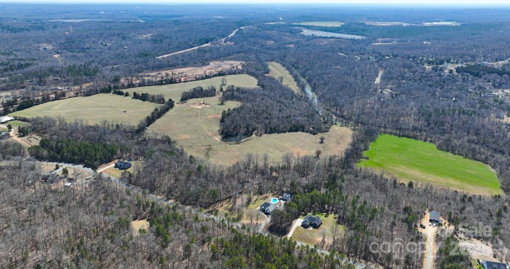 3400 Biggers Road Concord, NC 28025 - Photo 5 of 21 a view of a dry yard with large trees