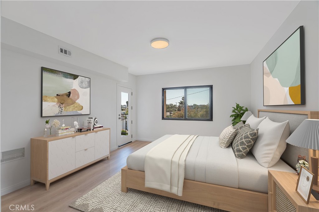 900 Cedar Street, Unit 308 El Segundo, CA 90245 - Photo 15 of 29 a bedroom with a bed and a large mirror on the dresser