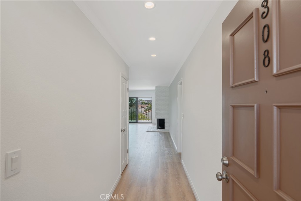900 Cedar Street, Unit 308 El Segundo, CA 90245 - Photo 2 of 29 a view of a hallway with wooden floor