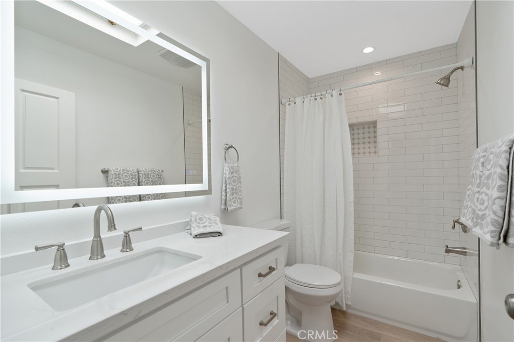 900 Cedar Street, Unit 308 El Segundo, CA 90245 - Photo 22 of 29 a bathroom with a granite countertop sink toilet and shower
