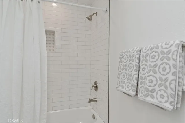 a large building with swimming pool in front of it