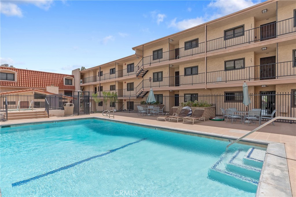 900 Cedar Street, Unit 308 El Segundo, CA 90245 - Photo 25 of 29 a large building with swimming pool in front of it