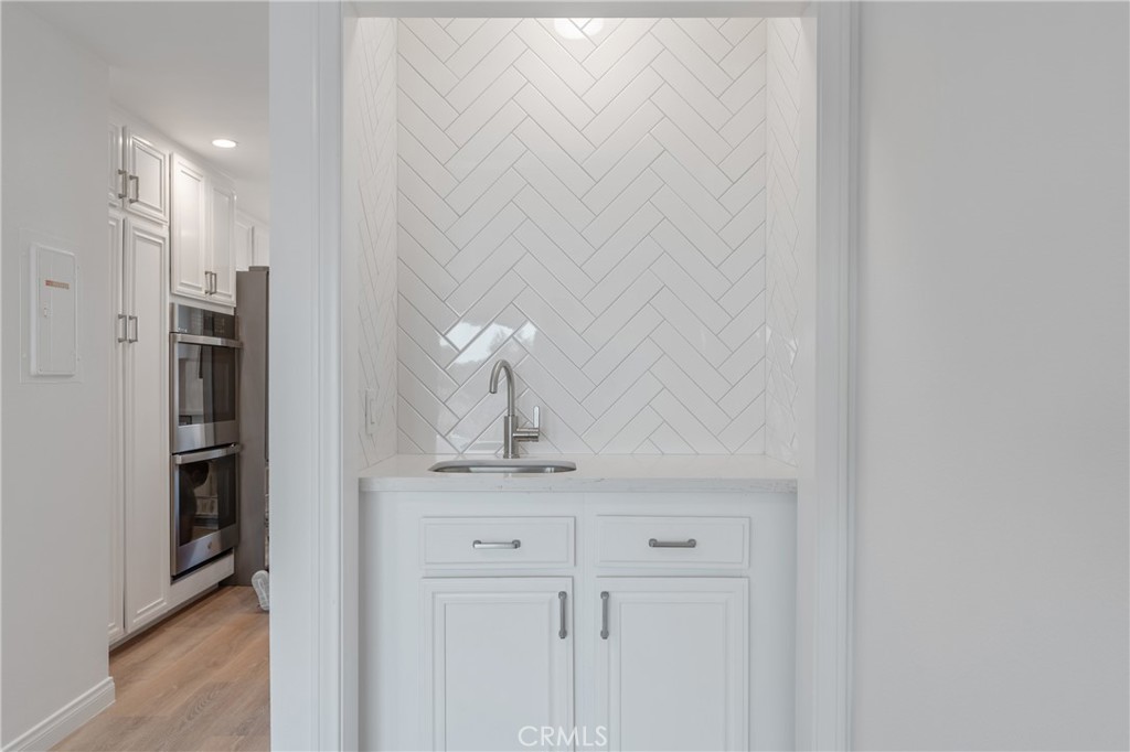 900 Cedar Street, Unit 308 El Segundo, CA 90245 - Photo 6 of 29 a bathroom with a sink and a mirror