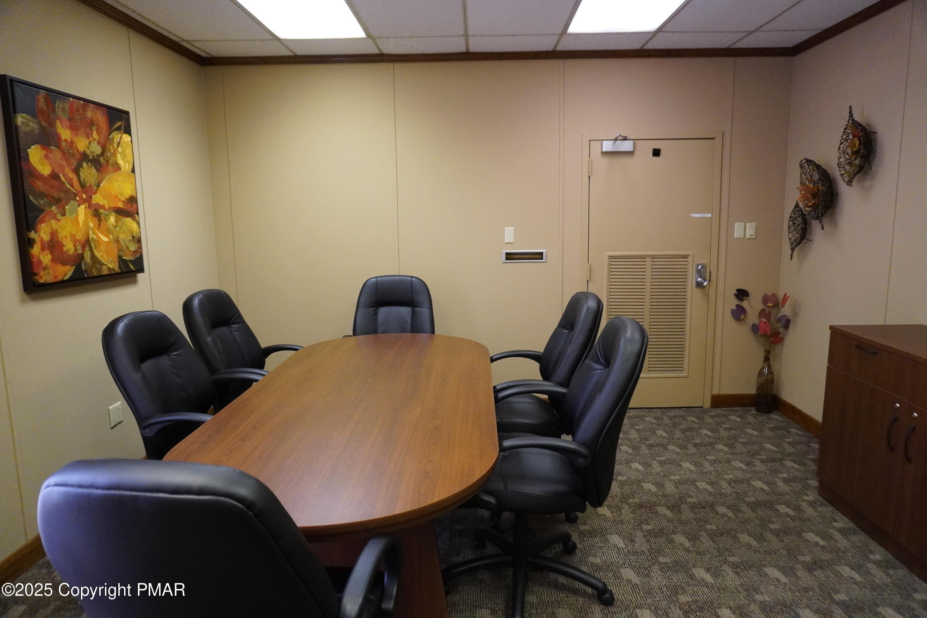 1201 North Church Street Hazleton, PA 18202 - Photo 7 of 7 a blue chair sitting in a bathroom next to a window