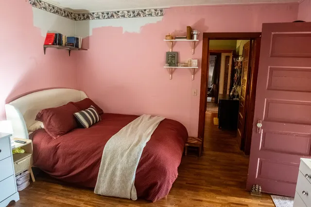 a bedroom with a bed and furniture