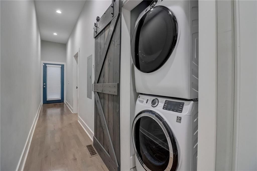 975 Welch Street Southwest Atlanta, GA 30310 - Photo 11 of 27 a view of a hallway with washer and dryer
