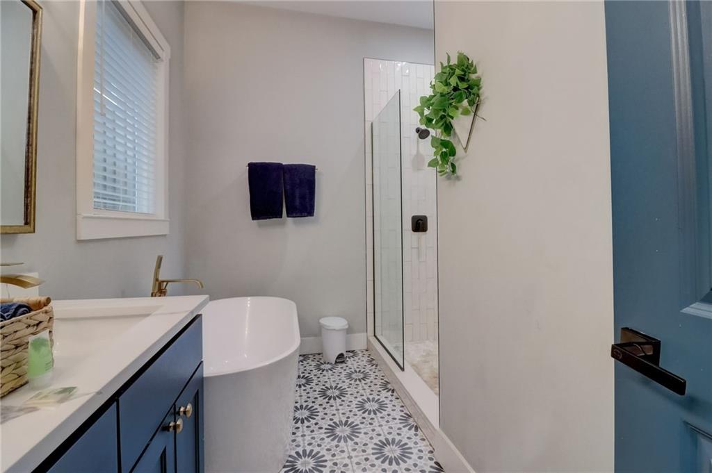 975 Welch Street Southwest Atlanta, GA 30310 - Photo 15 of 27 a bathroom with a sink and a mirror