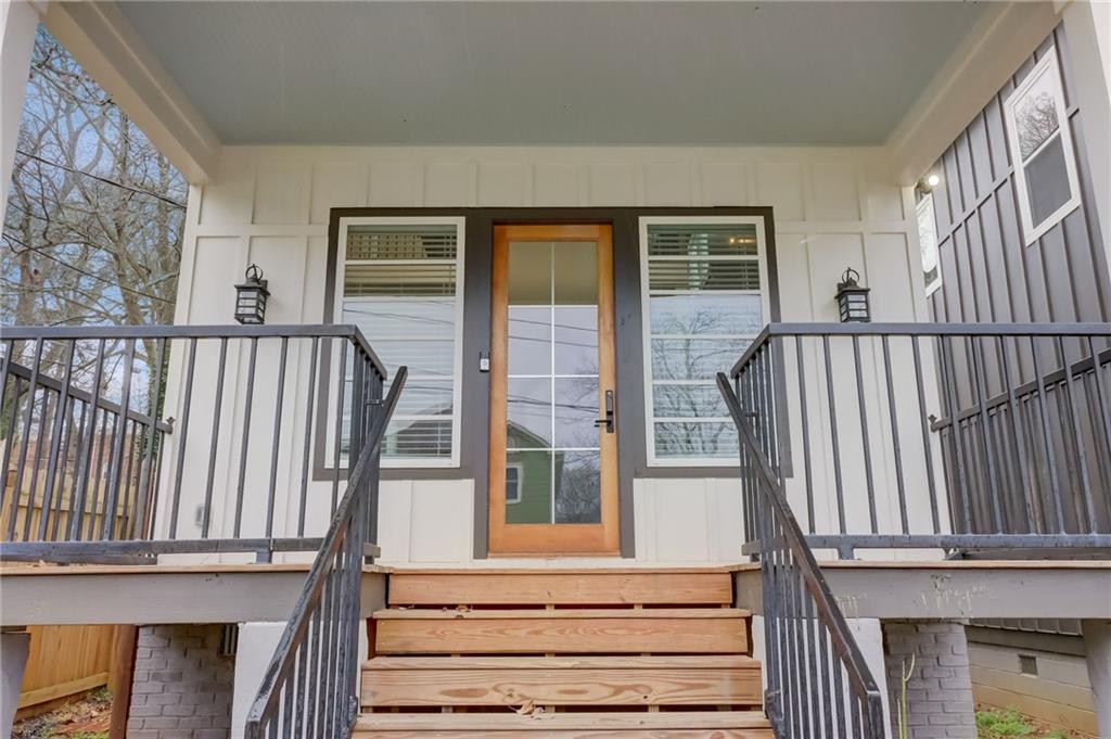975 Welch Street Southwest Atlanta, GA 30310 - Photo 2 of 27 a view of entryway with wooden floor and a front door