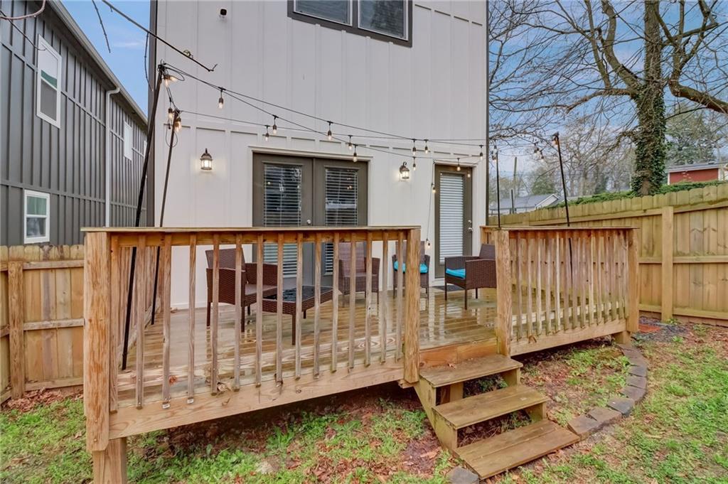 975 Welch Street Southwest Atlanta, GA 30310 - Photo 25 of 27 a view of a wooden deck with a yard