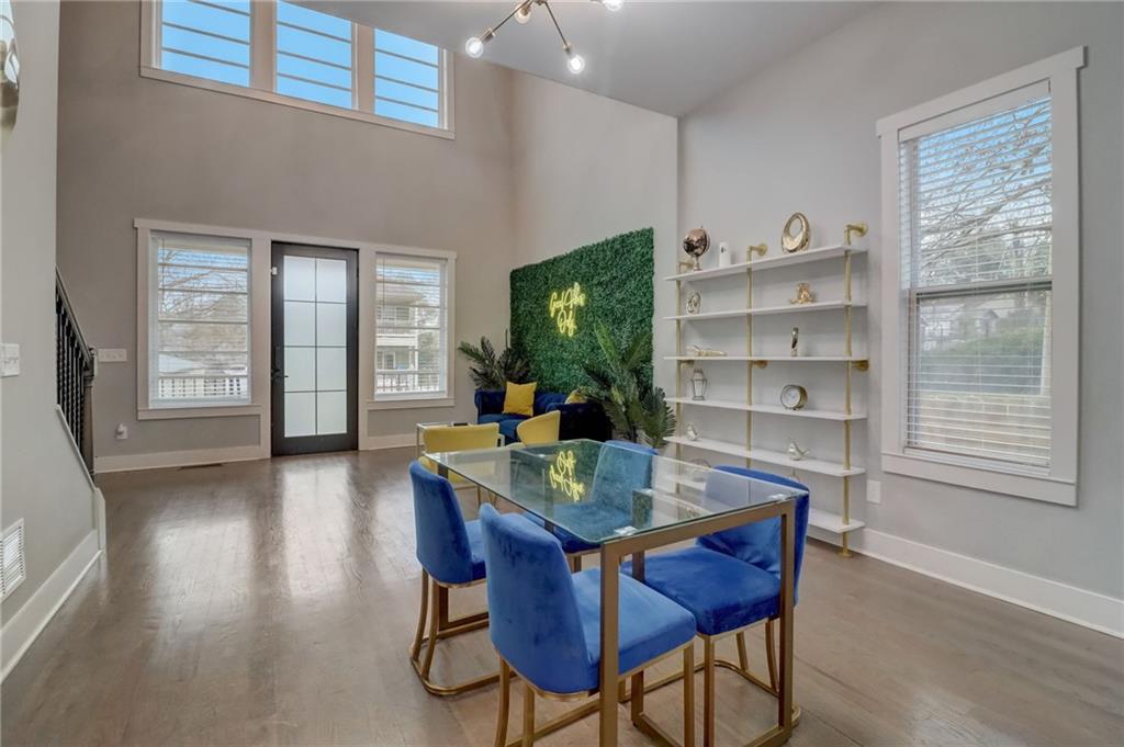 975 Welch Street Southwest Atlanta, GA 30310 - Photo 6 of 27 a view of a dining room with furniture and wooden floor