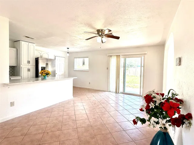 a view of a living room and a patio