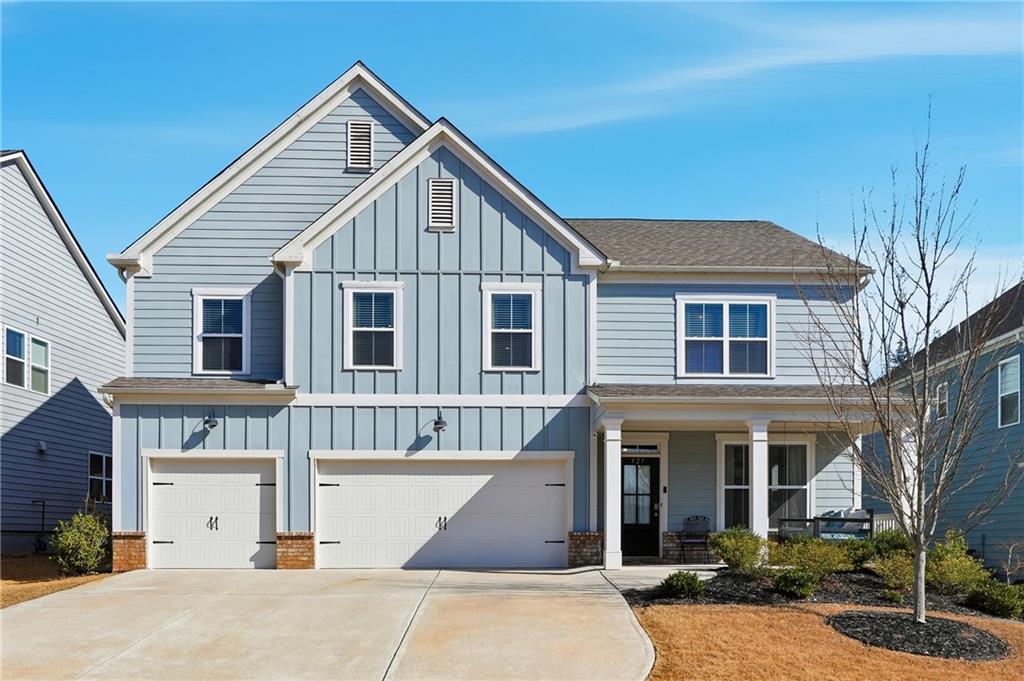 121 Treeline Trail Canton, GA 30115 - Photo 1 of 26 a front view of a house with garage