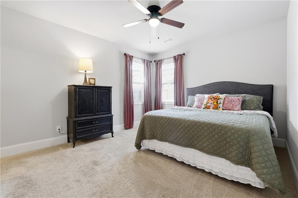 121 Treeline Trail Canton, GA 30115 - Photo 11 of 26 a bedroom with a bed and window