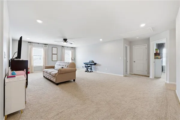 a bed room with a bed and a chair