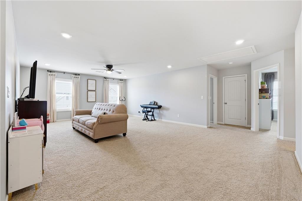 121 Treeline Trail Canton, GA 30115 - Photo 14 of 26 a living room with furniture and a flat screen tv