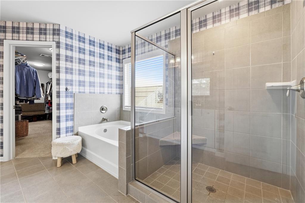 121 Treeline Trail Canton, GA 30115 - Photo 17 of 26 a bathroom with a shower and a bathtub