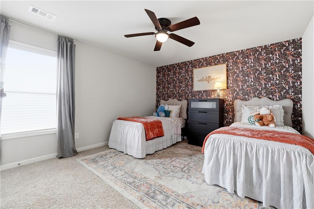 121 Treeline Trail Canton, GA 30115 - Photo 21 of 26 a bedroom with two beds and a window