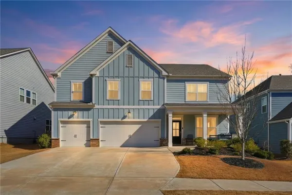 a view of multiple houses with a yard