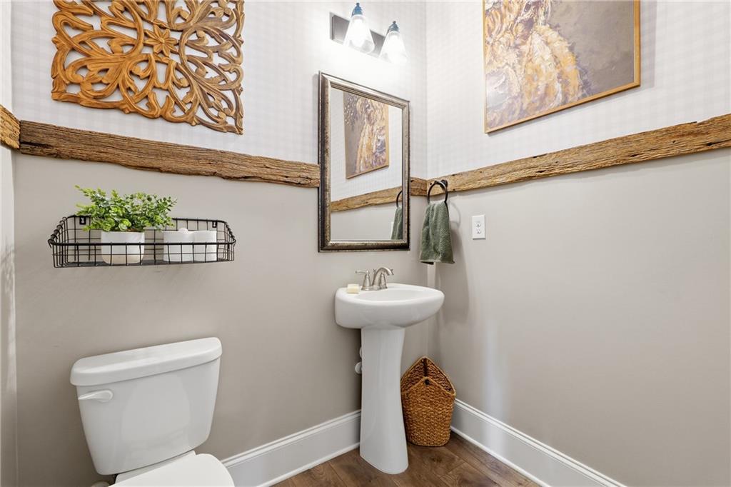 121 Treeline Trail Canton, GA 30115 - Photo 6 of 26 a bathroom with a toilet sink and mirror